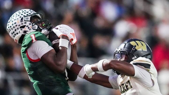 Lawrence North Wildcats Monshun Sales (1) catches a pass against Warren Central Terrell Harris (2) on Friday, Oct. 3, 2025, during a game between the Lawrence North Wildcats and Warren Central at Lawrence North High School in Indianapolis.