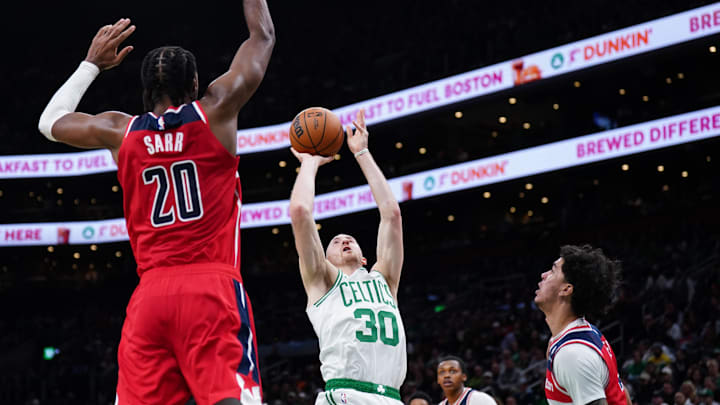 Nov 5, 2025; Boston, Massachusetts, USA; Boston Celtics forward Sam Hauser (30) shoots against Washington Wizards center Alex Sarr (20) in the second half at TD Garden. Mandatory Credit: David Butler II-Imagn Images
