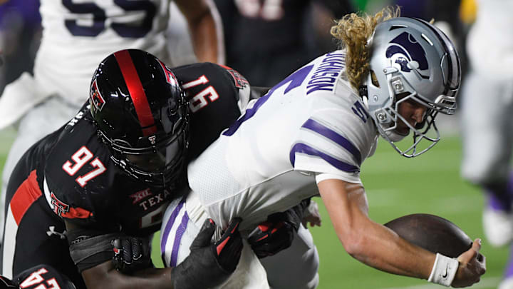 Kansas State's quarterback Avery Johnson scores a touchdown against Texas Tech in a Big 12 conference football game.