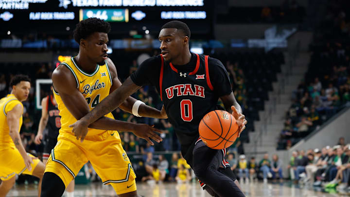 Utah Runnin' Utes forward Seydou Traore (0) drives to the basket against Baylor Bears guard Tounde Yessoufou (24) during the first half at Paul and Alejandra Foster Pavilion.