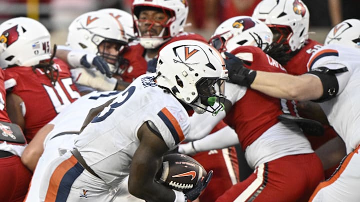 Oct 4, 2025; Louisville, Kentucky, USA; Virginia Cavaliers running back J'Mari Taylor (3) runs the ball in for a touchdown during the overtime against the Louisville Cardinals at L&N Federal Credit Union Stadium. Virginia defeated Louisville 30-27. Mandatory Credit: Jamie Rhodes-Imagn Images Oct 4, 2025; Louisville, Kentucky, USA; Virginia Cavaliers running back J'Mari Taylor (3) runs the ball in for a touchdown during the overtime against the Louisville Cardinals at L&N Federal Credit Union Stadium. Virginia defeated Louisville 30-27. Mandatory Credit: Jamie Rhodes-Imagn Images