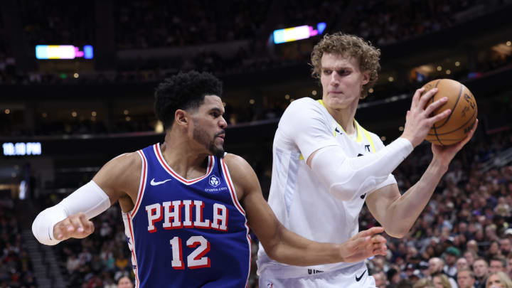 Feb 1, 2024; Salt Lake City, Utah, USA; Utah Jazz forward Lauri Markkanen (23) holds the all away from Philadelphia 76ers forward Tobias Harris (12) during the fourth quarter at Delta Center. Mandatory Credit: Rob Gray-USA TODAY Sports