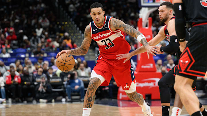 Jan 1, 2025; Washington, District of Columbia, USA; Washington Wizards forward Kyle Kuzma (33) handles the ball against Chicago Bulls guard Zach LaVine (8) during the second quarter at Capital One Arena. Mandatory Credit: Reggie Hildred-Imagn Images