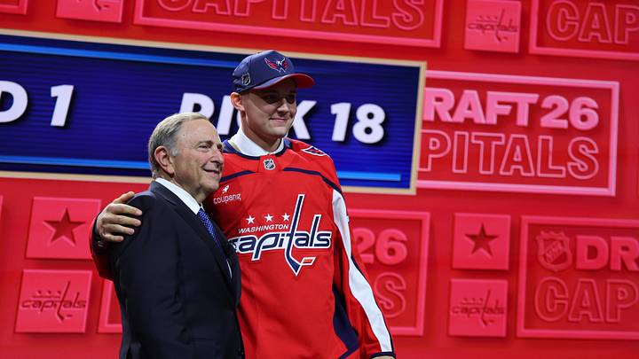 Jun 26, 2026; Buffalo, New York, USA; Oliver Suvanto reacts beside NHL commissioner Gary Bettman after being selected with the eighteenth pick in the first round of the 2026 NHL Draft by the Washington Capitals at KeyBank Center. Mandatory Credit: Timothy T. Ludwig-Imagn Images