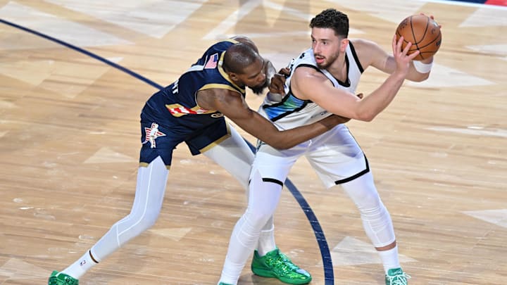 Feb 15, 2026; Inglewood, California, USA; Team World center Alperen Sengun (28) of the Houston Rockets controls the ball against Team USA Stripes forward Kevin Durant (7) of the Houston Rockets in game three during the 75th NBA All Star Game at Intuit Dome. Mandatory Credit: William Liang-Imagn Images
