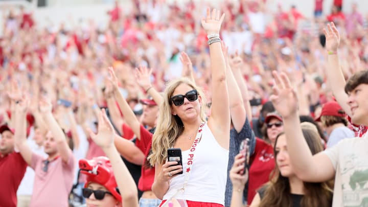 Aug 29, 2024; Little Rock, Arkansas, USA; Arkansas Razorbacks fans “call the hogs” prior to the game against the Pine Bluff Golden Lions at War Memorial Stadium. Mandatory Credit: Nelson Chenault-Imagn Images