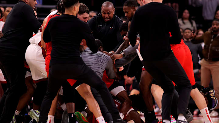 Dec 29, 2024; Houston, Texas, USA; Houston Rockets and Miami Heat players break up a fight between Houston Rockets guard Amen Thompson (1) and Miami Heat guard Tyler Herro (14) during the fourth quarter at Toyota Center. Mandatory Credit: Erik Williams-Imagn Images
