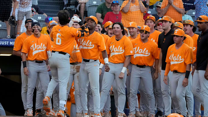 May 22, 2025; Hoover, AL, USA; Tennessee shortstop Gavin Kilen (6) is congratulated by teammates  the lead in the 10th inning in the third round of the SEC Baseball Tournament at the Hoover Met. Tennessee eliminated Texas with a 12-inning 7-5 victory. Kilen drove in all three runs in extra innings.