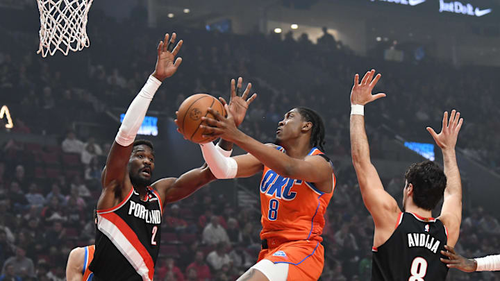 Nov 1, 2024; Portland, Oregon, USA; Oklahoma City Thunder guard/forward Jalen Williams (8) drives to the basket against Portland Trailblazers center Deandre Ayton (2) and forward Deni Avdija (8) during the first quarter at Moda Center. Mandatory Credit: Brian Murphy-Imagn Images