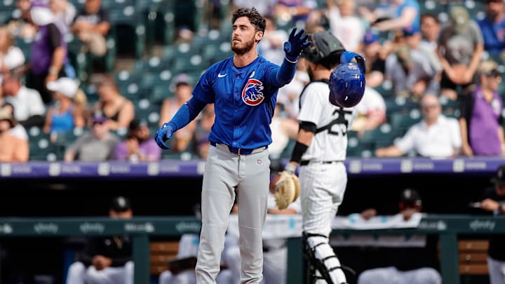 Sep 15, 2024; Denver, Colorado, USA; Chicago Cubs right fielder Cody Bellinger (24) tosses his helmet after striking out with the bases loaded in the ninth inning against the Colorado Rockies at Coors Field. Mandatory Credit: Isaiah J. Downing-Imagn Images