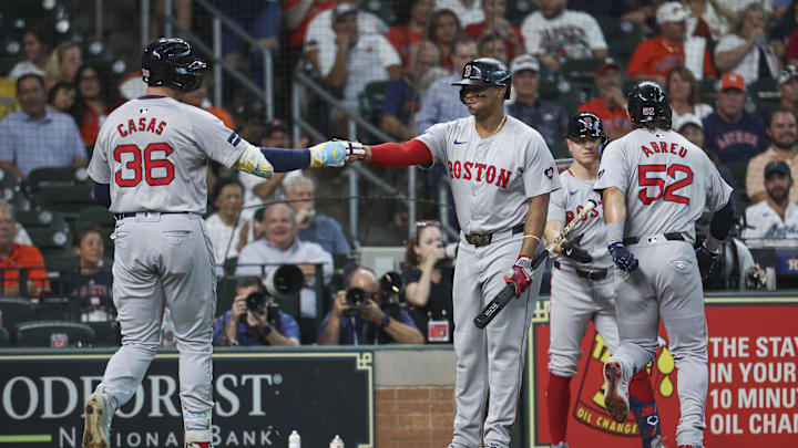 Aug 20, 2024; Houston, Texas, USA; Boston Red Sox first baseman Triston Casas (36) celebrates with third baseman Rafael Devers (11) after hitting a home run during the first inning against the Houston Astros at Minute Maid Park. Mandatory Credit: Troy Taormina-Imagn Images