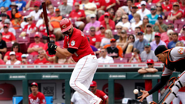 Cincinnati Reds first baseman Mike Moustakas (9) looks back after a check-swing hit as Baltimore Orioles catcher Robinson Chirinos (23) picks up the ball to start a double play during the fourth inning of a baseball game, Sunday, July 31, 2022, Great American Ball Park in Cincinnati.

Baltimore Orioles At Cincinnati Reds July 31 0009