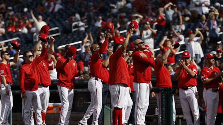 Sep 28, 2025; Washington, District of Columbia, USA; Washington Nationals players and coaches tip caps to retiring Nationals play-by-play television presenter Bob Carpenter (not pictured) prior to their game against the Chicago White Sox at Nationals Park. 