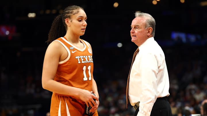 Apr 3, 2026; Phoenix, AZ, USA; Texas Longhorns head coach Vic Schaefer talks with forward Justice Carlton (11) in the second half against the UCLA Bruins during a semifinal of the Final Four of the women's 2026 NCAA Tournament at Mortgage Matchup Center. Mandatory Credit: Mark J. Rebilas-Imagn Images