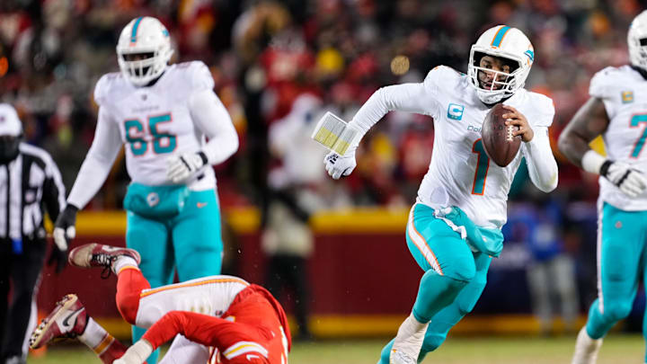 Jan 13, 2024; Kansas City, Missouri, USA; Miami Dolphins quarterback Tua Tagovailoa (1) runs the