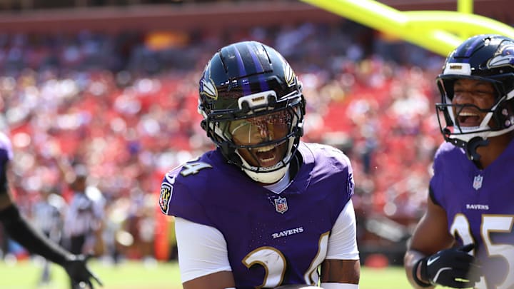 Baltimore Ravens cornerback Thomas Graham Jr. celebrates after scoring a touchdown against the Washington Commanders.