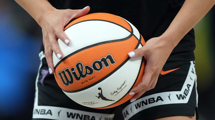 Aug 31, 2025; San Francisco, California, USA; Golden State Valkyries guard Kaitlyn Chen (2) holds a ball as the WNBA logo appears on the ball and shorts before the game against the Indiana Fever at Chase Center. Mandatory Credit: Darren Yamashita-Imagn Images