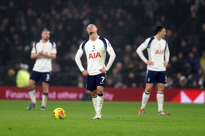 Tottenham players appearing dejected.