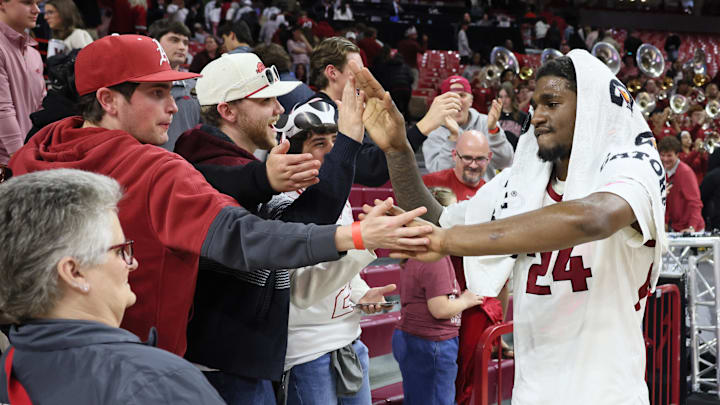 Feb 21, 2026; Fayetteville, Arkansas, USA; Arkansas Razorbacks wing Billy Richmond III (24) celebrates with fans after the game against the Missouri Tigers at Bud Walton Arena. Arkansas won 94-86. Mandatory Credit: Nelson Chenault-Imagn Images
