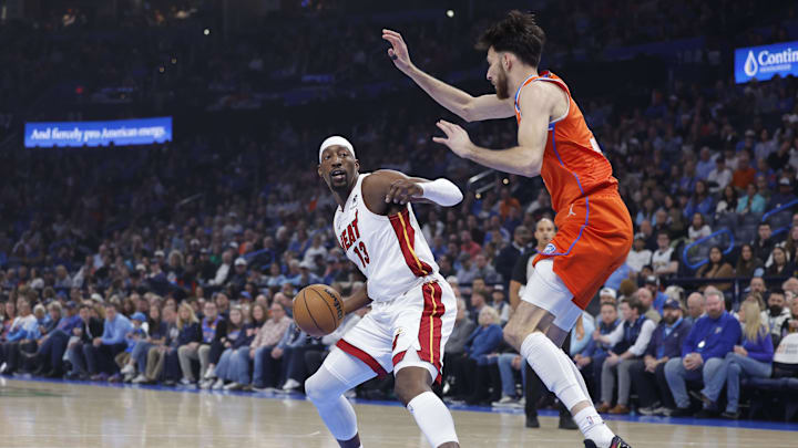 Jan 11, 2026; Oklahoma City, Oklahoma, USA; Oklahoma City Thunder center/forward Chet Holmgren (7) defends a drive by Miami Heat center/forward Bam Adebayo (13) during the first quarter at Paycom Center.