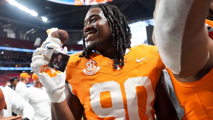 Tennessee defensive lineman Dominic Bailey (90) holds up a plush Aflac duck after the Aflac Kickoff Game between the Volunteers and Syracuse held at Mercedes-Benz Stadium in Atlanta, Ga., on August 30, 2025.