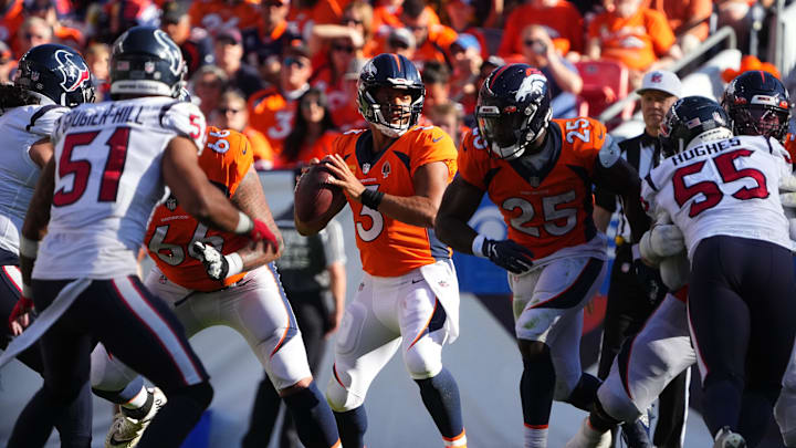 Sep 18, 2022; Denver, Colorado, USA; Denver Broncos quarterback Russell Wilson (3) looks to pass in