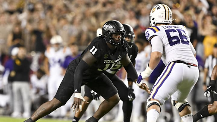 Oct 26, 2024; College Station, Texas, USA; Texas A&M Aggies defensive lineman Nic Scourton (11) defends in coverage against LSU Tigers offensive tackle Will Campbell (66) during the fourth quarter. The Aggies defeated the Tigers 38-23; at Kyle Field. Mandatory Credit: Maria Lysaker-Imagn Images. Oct 26, 2024; College Station, Texas, USA; Texas A&M Aggies defensive lineman Nic Scourton (11) defends in coverage against LSU Tigers offensive tackle Will Campbell (66) during the fourth quarter. The Aggies defeated the Tigers 38-23; at Kyle Field. Mandatory Credit: Maria Lysaker-Imagn Images.