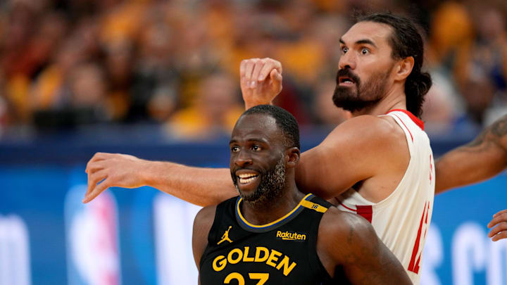 Golden State Warriors forward Draymond Green battles for position with Houston Rockets center Steven Adams.