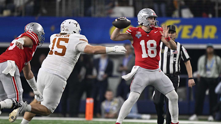 Jan 10, 2025; Arlington, Texas, USA; Ohio State Buckeyes quarterback Will Howard (18) throws against Texas Longhorns defensive lineman Bill Norton (15) during the second quarter of the College Football Playoff semifinal in the Cotton Bowl at AT&T Stadium. Mandatory Credit: Jerome Miron-USA TODAY Sports Jan 10, 2025; Arlington, Texas, USA; Ohio State Buckeyes quarterback Will Howard (18) throws against Texas Longhorns defensive lineman Bill Norton (15) during the second quarter of the College Football Playoff semifinal in the Cotton Bowl at AT&T Stadium. Mandatory Credit: Jerome Miron-USA TODAY Sports