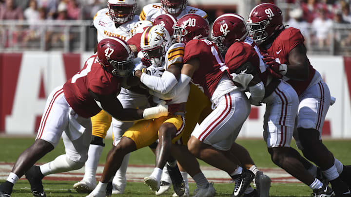 Sep 17, 2022; Tuscaloosa, Alabama, USA; Several Alabama defenders tackle ULM running back Isaiah Phillips (3) at Bryant-Denny Stadium. Sep 17, 2022; Tuscaloosa, Alabama, USA; Several Alabama defenders tackle ULM running back Isaiah Phillips (3) at Bryant-Denny Stadium.