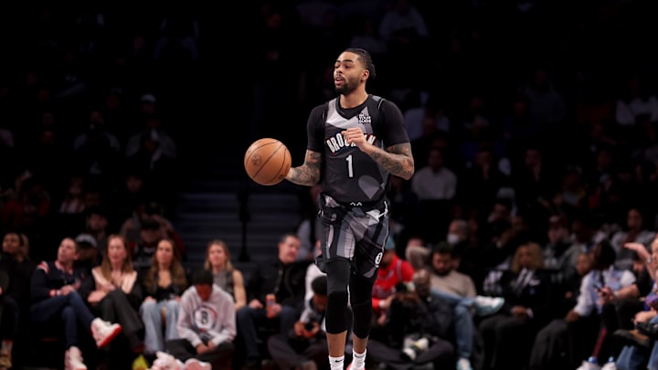 Feb 12, 2025; Brooklyn, New York, USA; Brooklyn Nets guard D'Angelo Russell (1) brings the ball up court against the Philadelphia 76ers during the second quarter at Barclays Center. Mandatory Credit: Brad Penner-Imagn Images