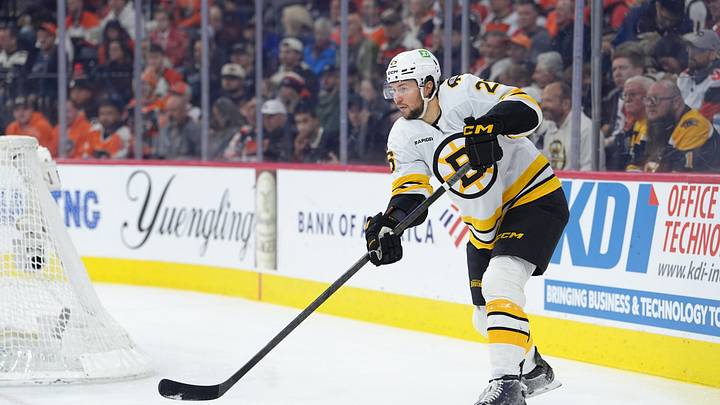 Apr 5, 2026; Philadelphia, Pennsylvania, USA; Boston Bruins defenseman Andrew Peeke (26) passes the puck against the Philadelphia Flyers in the first period at Xfinity Mobile Arena. Mandatory Credit: Kyle Ross-Imagn Images Apr 5, 2026; Philadelphia, Pennsylvania, USA; Boston Bruins defenseman Andrew Peeke (26) passes the puck against the Philadelphia Flyers in the first period at Xfinity Mobile Arena. Mandatory Credit: Kyle Ross-Imagn Images