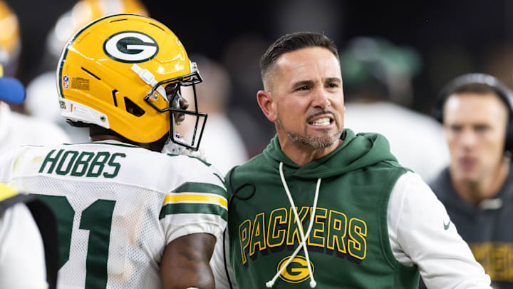 Oct 19, 2025; Glendale, Arizona, USA; Green Bay Packers head coach Matt LaFleur with cornerback Nate Hobbs (21) against the Arizona Cardinals at State Farm Stadium. Mandatory Credit: Mark J. Rebilas-Imagn Images