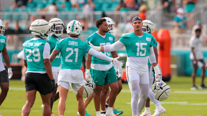 Jul 28, 2025; Miami Gardens, MI, USA; Miami Dolphins linebacker Jaelan Phillips (15) high-fives safety Ashtyn Davis (21) during training camp at Baptist Health Training Complex. Mandatory Credit: Sam Navarro-Imagn Images