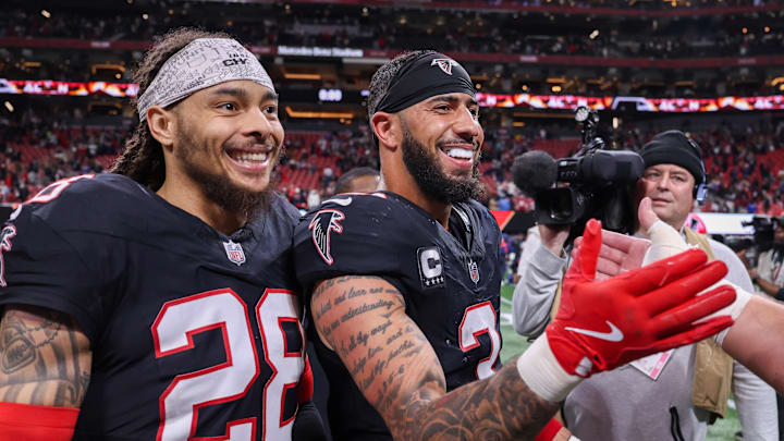 Dec 29, 2025; Atlanta, Georgia, USA; Atlanta Falcons cornerback Mike Ford Jr. (28) and safety Jessie Bates III (3) celebrate after a victory over the Los Angeles Rams at Mercedes-Benz Stadium. Mandatory Credit: Brett Davis-Imagn Images

