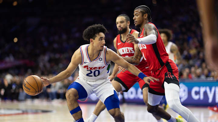 Nov 27, 2024; Philadelphia, Pennsylvania, USA; Philadelphia 76ers guard Jared McCain (20) controls the ball against Houston Rockets guard Jalen Green (4) during the second quarter at Wells Fargo Center. Mandatory Credit: Bill Streicher-Imagn Images