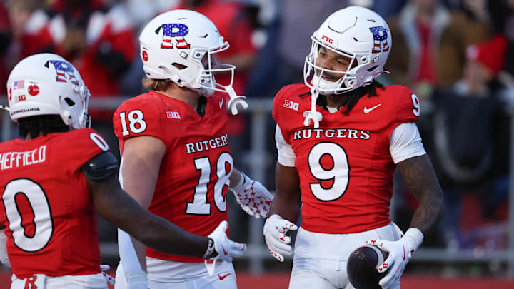 Nov 8, 2025; Piscataway, New Jersey, USA; Rutgers Scarlet Knights wide receiver Ian Strong (9) celebrates with teammates after a touchdown reception during the second half against the Maryland Terrapins at SHI Stadium. 