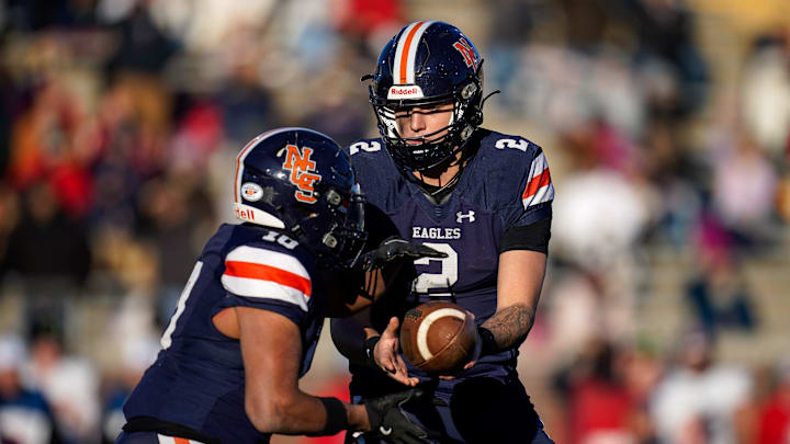 Nashville Christian's Jared Curtis (2) hands off to Terry Ward (10) during the second quarter of the Division II-A championship game against Columbia Academy at Finley Stadium in Chattanooga, Tenn., Thursday, Dec. 5, 2024.