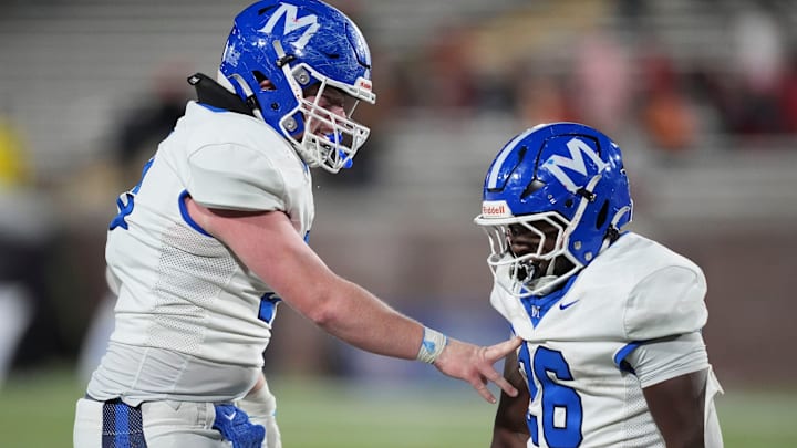 McCallie's Caden Lockhart (52) and Keylan Syam (26) celebrate after Syam scored a touchdown in the final moments of the TSSAA Division II-AAA high school football championship against Baylor on Thursday, Dec. 5, 2024, in Chattanooga, Tenn.