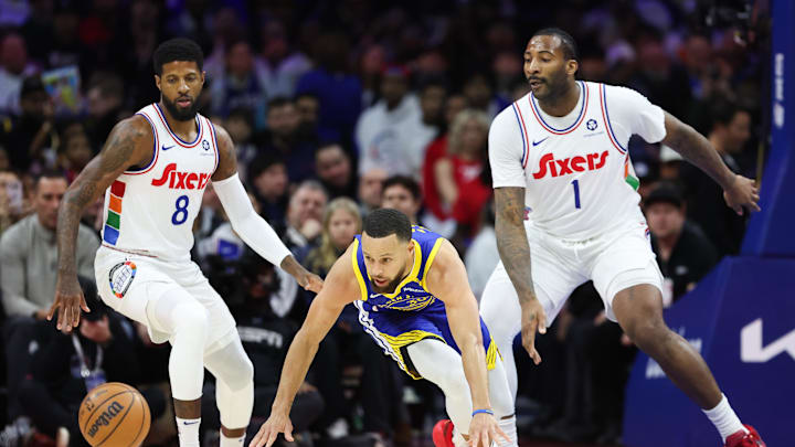 Mar 1, 2025; Philadelphia, Pennsylvania, USA; Golden State Warriors guard Stephen Curry (30) looses control of the ball in front of Philadelphia 76ers forward Paul George (8) and center Andre Drummond (1) during the first quarter at Wells Fargo Center. Mandatory Credit: Bill Streicher-Imagn Images Mar 1, 2025; Philadelphia, Pennsylvania, USA; Golden State Warriors guard Stephen Curry (30) looses control of the ball in front of Philadelphia 76ers forward Paul George (8) and center Andre Drummond (1) during the first quarter at Wells Fargo Center. Mandatory Credit: Bill Streicher-Imagn Images