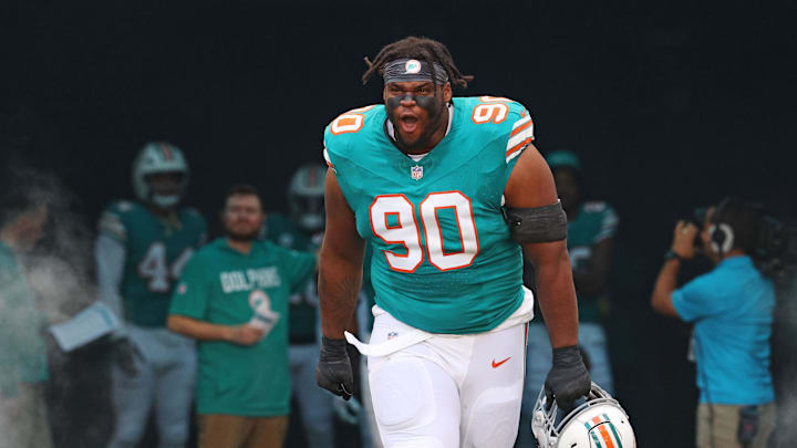 Miami Dolphins defensive tackle Kenneth Grant (90) enters the field before the game against the Cincinnati Bengals at Hard Rock Stadium. Miami Dolphins defensive tackle Kenneth Grant (90) enters the field before the game against the Cincinnati Bengals at Hard Rock Stadium.