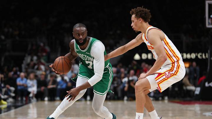 Mar 30, 2026; Atlanta, Georgia, USA; Boston Celtics guard Jaylen Brown (7) dribbles against Atlanta Hawks guard Dyson Daniels (5) in the first half at State Farm Arena. Mandatory Credit: Mady Mertens-Imagn Images