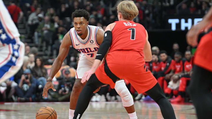 Oct 25, 2024; Toronto, Ontario, CAN;  Philadelphia 76ers guard Kyle Lowry (7) dribbles the ball as Toronto Raptors guard Gradey Dick (1) defends in the first half at Scotiabank Arena. Mandatory Credit: Dan Hamilton-Imagn Images