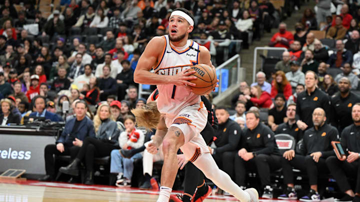 Feb 23, 2025; Toronto, Ontario, CAN; Phoenix Suns guard Devin Booker (1) drives to the basket against the Toronto Raptors in the second half at Scotiabank Arena. Mandatory Credit: Dan Hamilton-Imagn Images Feb 23, 2025; Toronto, Ontario, CAN; Phoenix Suns guard Devin Booker (1) drives to the basket against the Toronto Raptors in the second half at Scotiabank Arena. Mandatory Credit: Dan Hamilton-Imagn Images