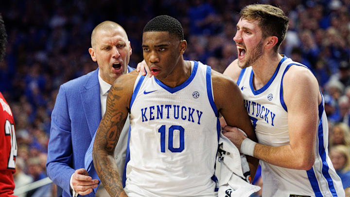 Dec 14, 2024; Lexington, Kentucky, USA; Kentucky Wildcats head coach Mark Pope and forward Andrew Carr (7) celebrate with forward Brandon Garrison (10) during the second half against the Louisville Cardinals at Rupp Arena at Central Bank Center. Mandatory Credit: Jordan Prather-Imagn Images
