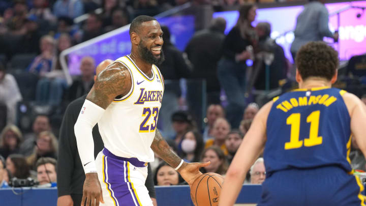 Jan 27, 2024; San Francisco, California, USA; Los Angeles Lakers forward LeBron James (23) reacts while dribbling against Golden State Warriors guard Klay Thompson (11) during the first quarter at Chase Center. Mandatory Credit: Darren Yamashita-USA TODAY Sports