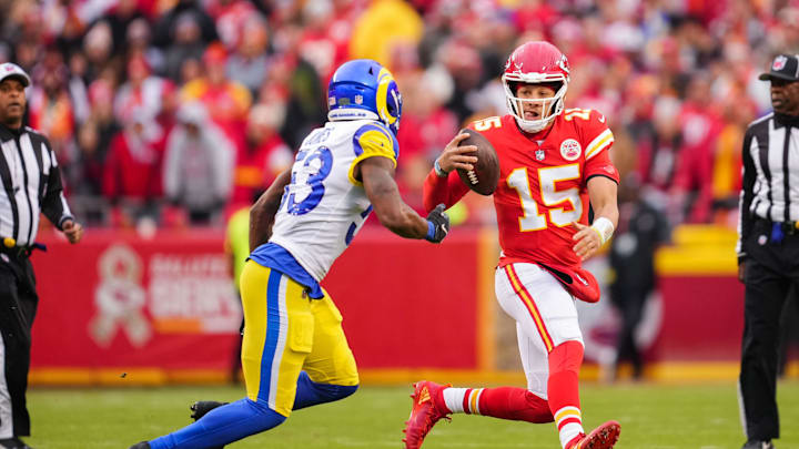 Nov 27, 2022; Kansas City, Missouri, USA; Kansas City Chiefs quarterback Patrick Mahomes (15) and Los Angeles Rams linebacker Ernest Jones (53) during the first half at GEHA Field at Arrowhead Stadium. Mandatory Credit: Jay Biggerstaff-Imagn Images