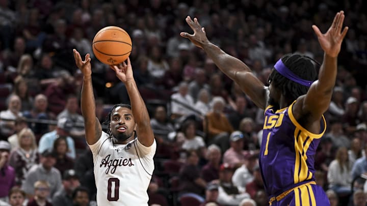 Jan 3, 2026; College Station, Texas, USA;  Texas A&M Aggies guard Marcus Hill (0) shoots a three point basket during the first half against the Louisiana State Tigers at Reed Arena. Mandatory Credit: Maria Lysaker-Imagn Images 