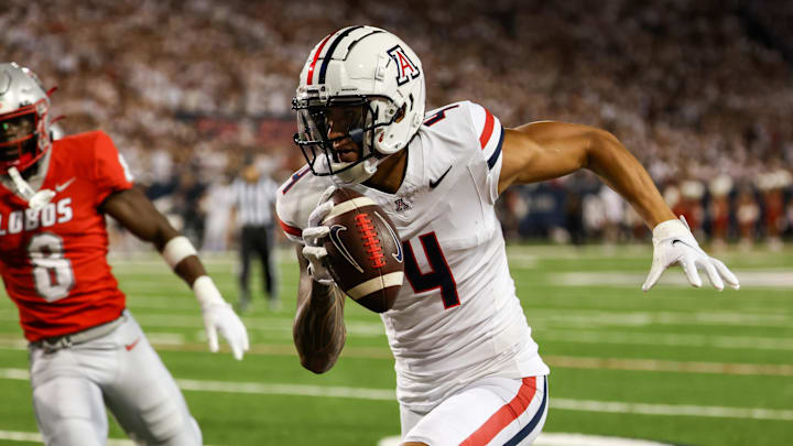 Aug 31, 2024; Tucson, Arizona, USA; New Mexico Lobos safety Christian Ellis (8) chases after Arizona Wildcats wide receiver Tetairoa McMillan (4) as he runs for the touchdown during first quarter at Arizona Stadium. Mandatory Credit: Aryanna Frank-Imagn Images