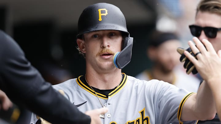 Jun 19, 2025; Detroit, Michigan, USA;  Pittsburgh Pirates outfielder Billy Cook (25) receives congratulations from teammates after scoring in the fifth inning against the Detroit Tigers at Comerica Park. Mandatory Credit: Rick Osentoski-Imagn Images